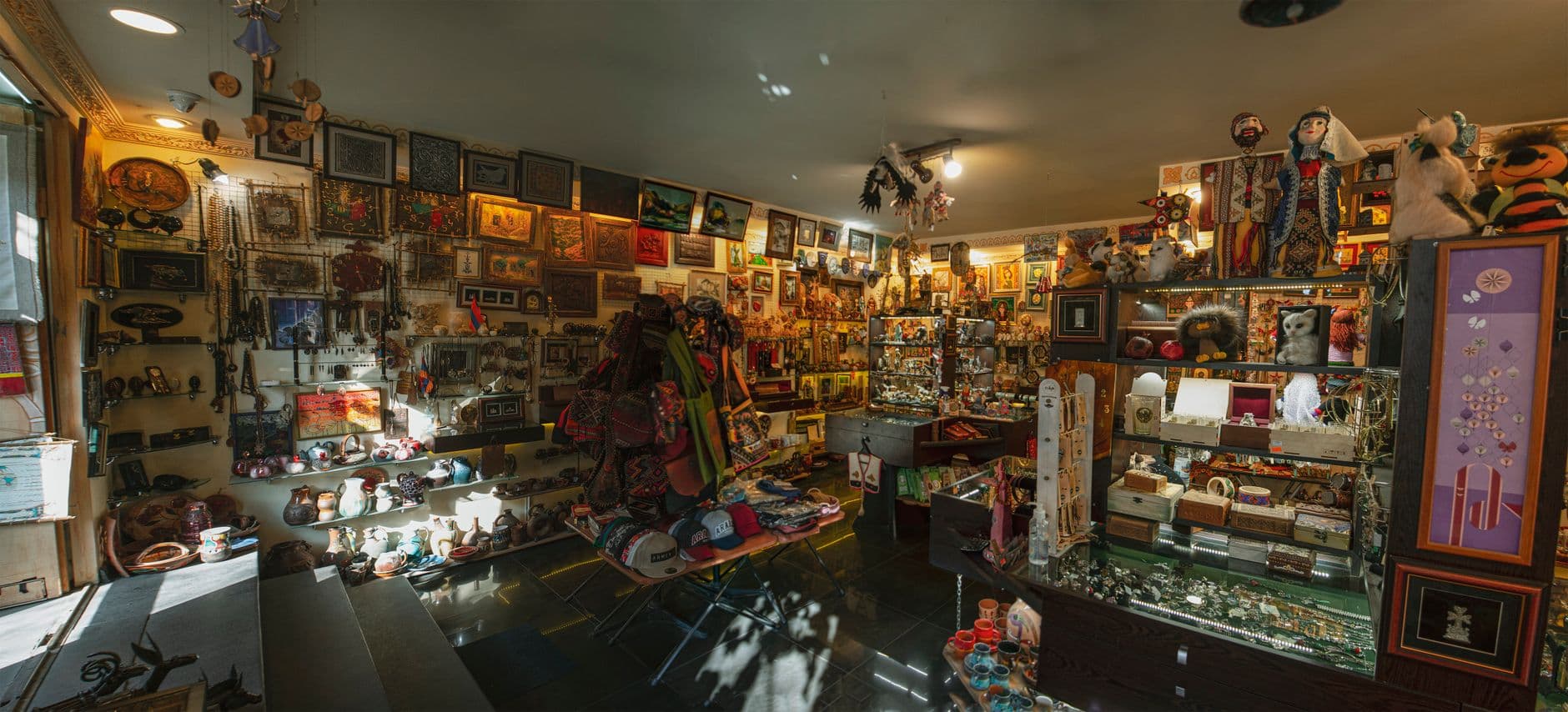Vibrant interior showcasing diverse souvenirs, arts, and crafts.