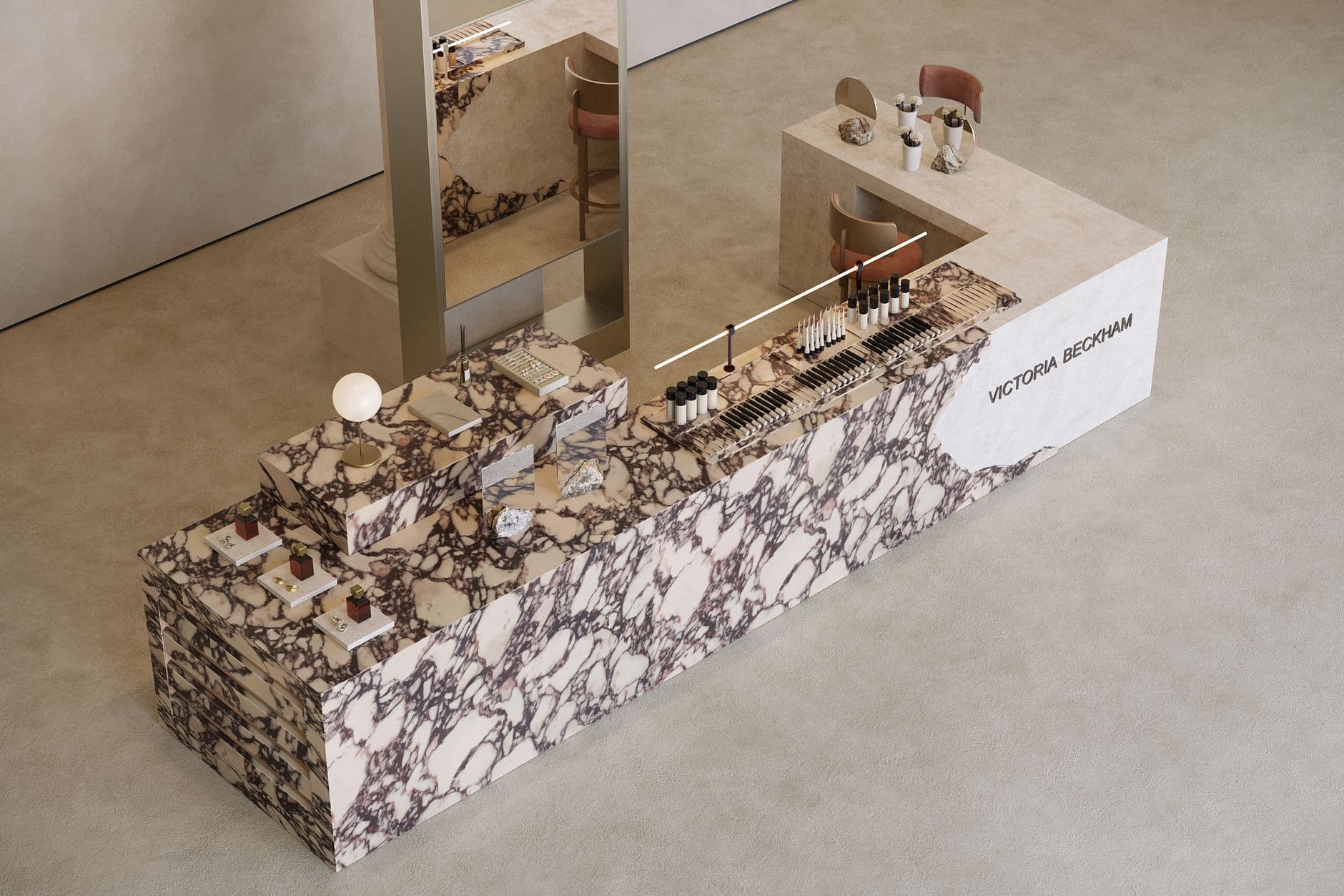 Luxurious makeup display with marble design featuring branded cosmetics in a minimalist setting.